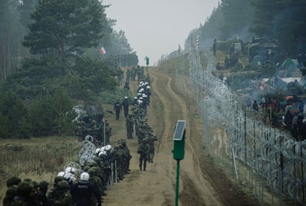 Soldiers from the Polish Armed Forces patrol the Belarus-Polish border on November 11, 2021 in Kuznica, Poland.
