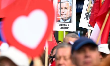 A poster showing Jarosław Kaczyński behind bars during an opposition march in Warsaw.