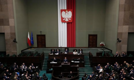 Newly elected Poland's Prime Minister Donald Tusk addresses lawmakers during his speech at the parliament in Warsaw, Poland, Tuesday Dec. 12, 2023.