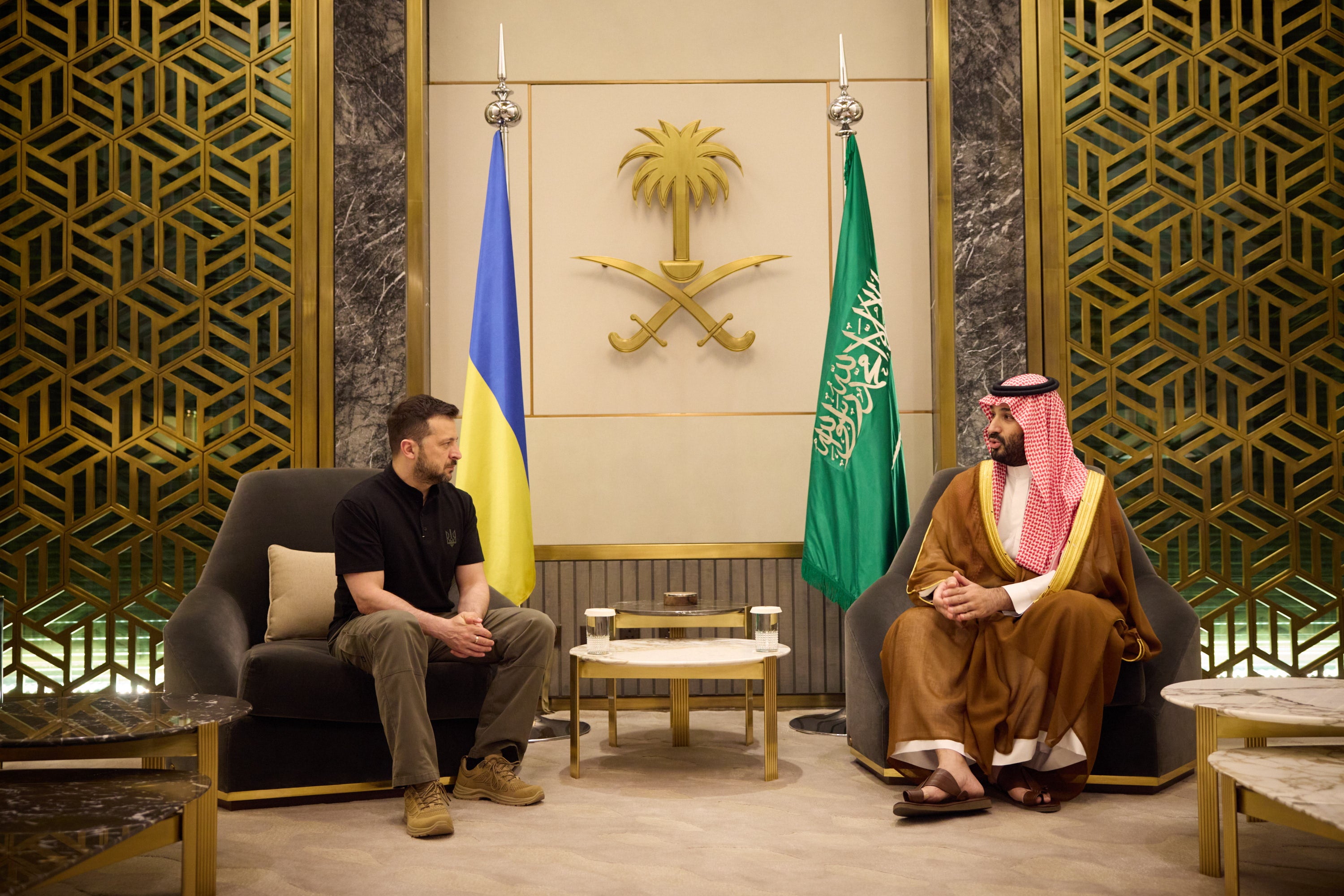 A handout photo made available by the Ukrainian Presidential Press Service shows Saudi Crown Prince Mohammed bin Salman (R) meeting with Ukrainian President Volodymyr Zelensky in Jeddah, Saudi Arabia