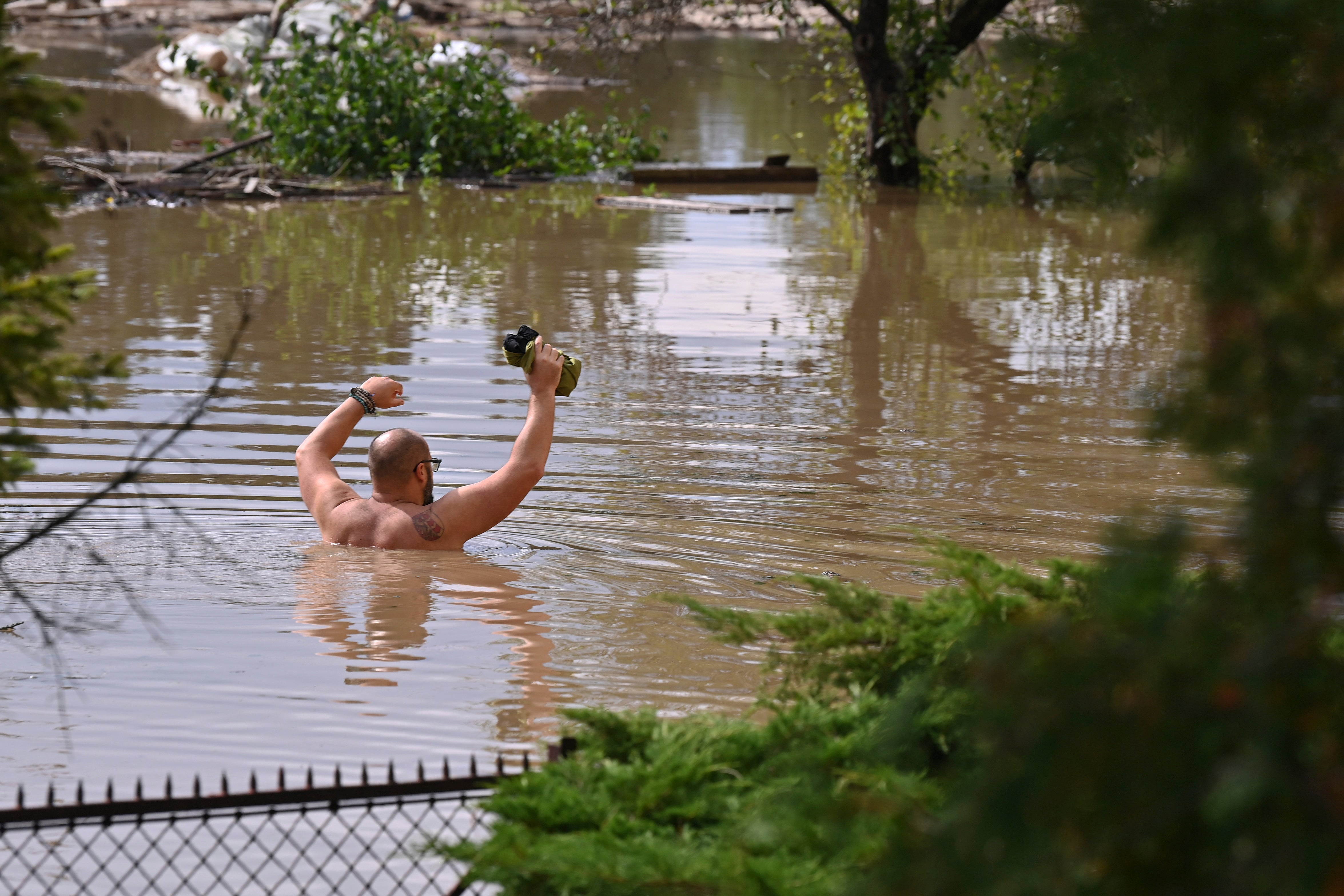 A man wades through flood water in the Czech Republic