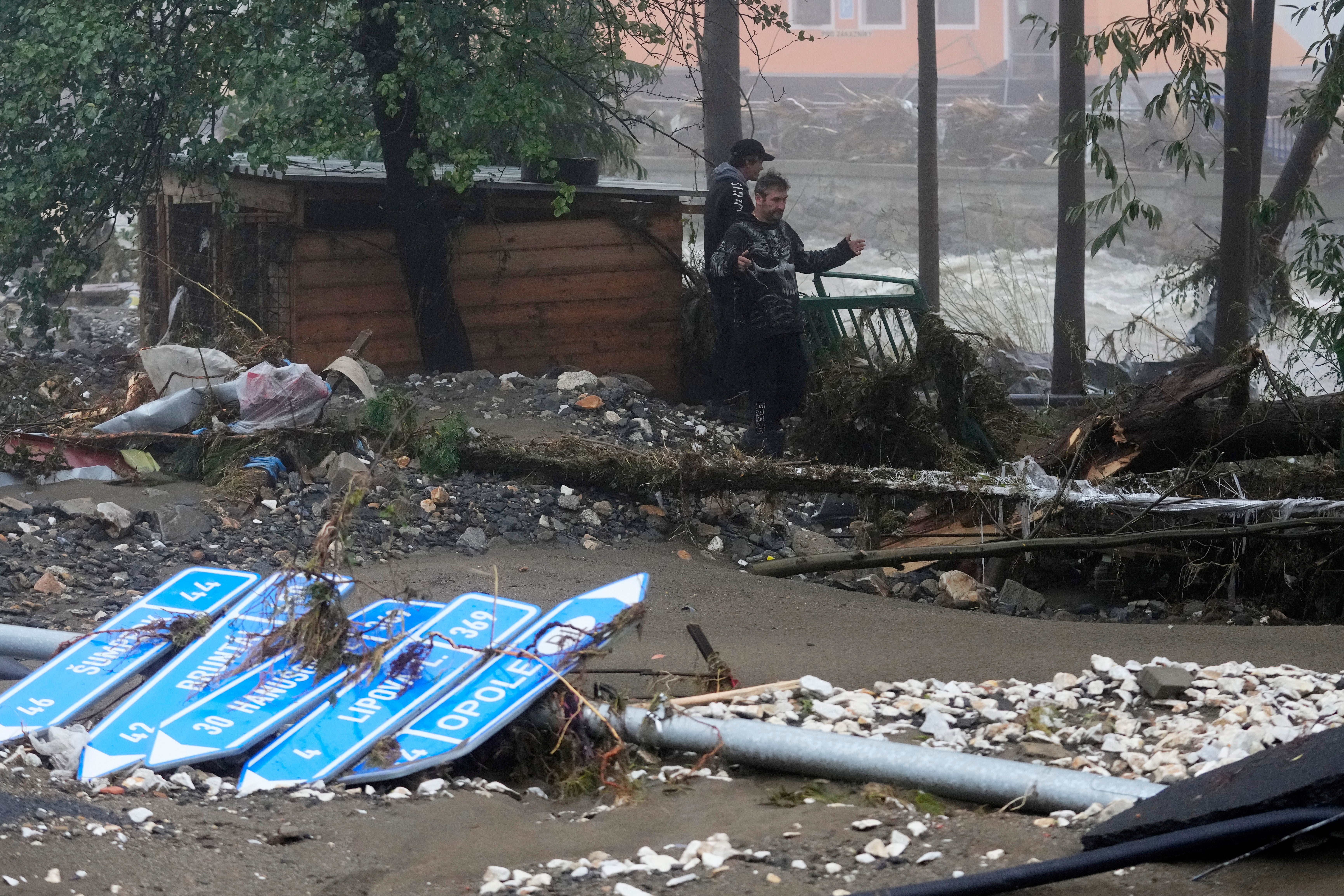 Residents look at the damage done by recent floods in Jesenik, Czech Republic, Monday, Sept. 16