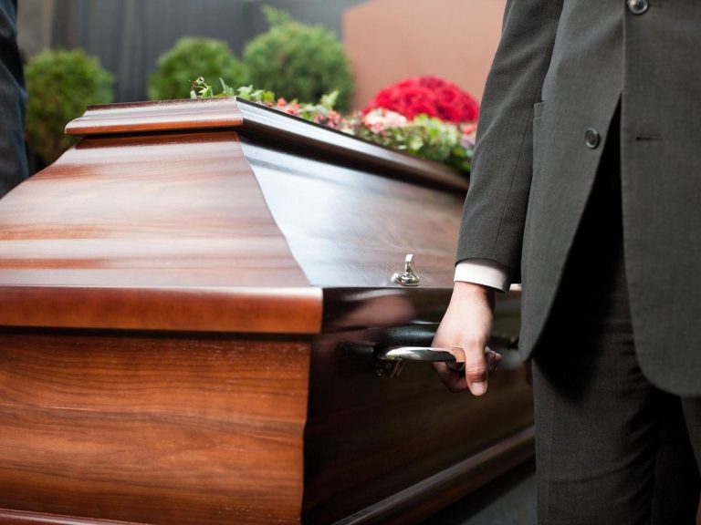 Polish funeral home apologises after corpse falls out of hearse into traffic